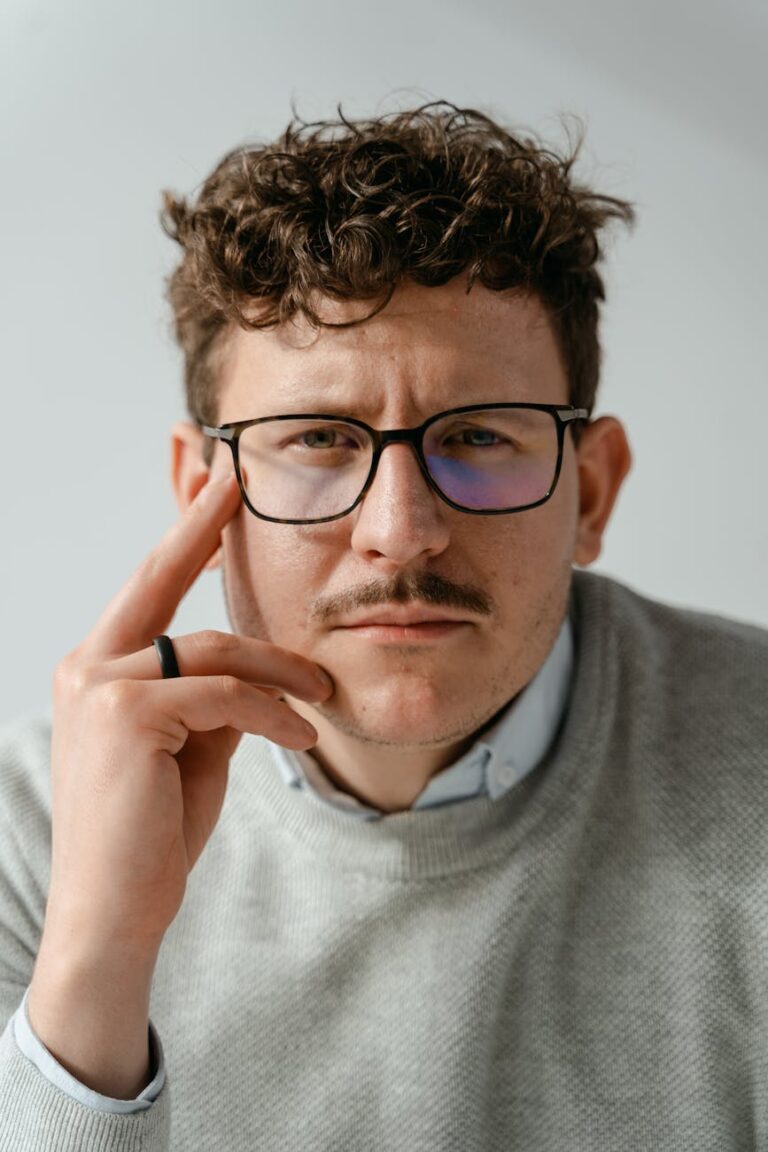 close up shot of a man wearing eyeglasses